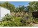 The backyard features a garden with green foliage and a privacy wall in a tranquil setting at 1810 N Sunaire Cir, Mesa, AZ 85205