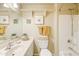 Well-lit bathroom with a single vanity, and a shower-tub combination providing a clean and functional space at 1810 N Sunaire Cir, Mesa, AZ 85205