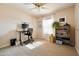 Cozy bedroom featuring neutral carpets, natural light, and ample closet space at 1810 N Sunaire Cir, Mesa, AZ 85205
