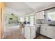 Open kitchen and living space with ample counter space and eat-in bar at 1810 N Sunaire Cir, Mesa, AZ 85205