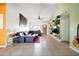 Living room featuring tile floors, a plush sectional, and a ceiling fan at 1810 N Sunaire Cir, Mesa, AZ 85205