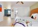 Spacious main bedroom featuring open access to bathroom, adjacent office, and natural light; great owner's suite at 1810 N Sunaire Cir, Mesa, AZ 85205