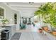 This patio has an outdoor sink, chairs, and workout equipment and overlooks the pool area at 1810 N Sunaire Cir, Mesa, AZ 85205