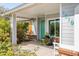 Inviting front porch with colorful door and plantings that enhance curb appeal at 1810 N Sunaire Cir, Mesa, AZ 85205