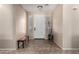 Inviting entryway with neutral walls, tiled flooring, and stylish bench seating at 18492 E Oak Hill Ln, Queen Creek, AZ 85142