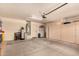 Spacious garage with ample storage, and white walls at 18492 E Oak Hill Ln, Queen Creek, AZ 85142