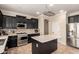 Well-appointed kitchen with stainless appliances, a center island, and stylish cabinetry at 18492 E Oak Hill Ln, Queen Creek, AZ 85142