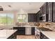 Well-equipped kitchen with stainless steel appliances, granite countertops, and ample storage at 18492 E Oak Hill Ln, Queen Creek, AZ 85142