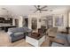 Bright open concept living room and kitchen with hardwood floors and lots of room to relax at 18492 E Oak Hill Ln, Queen Creek, AZ 85142