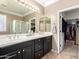 Large bathroom with dual sinks, tile floors, and a separate water closet at 18492 E Oak Hill Ln, Queen Creek, AZ 85142