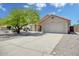 Beautiful single-story home featuring a well-kept lawn, desert landscaping, and spacious two car garage at 18802 N 71St Ln, Glendale, AZ 85308