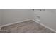 Bright laundry room features wood-look tile floors and modern hookups ready for appliances at 1917 S 246Th Ln, Buckeye, AZ 85326