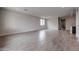 Expansive living room showcases recessed lighting, tile flooring and bright, neutral paint at 1917 S 246Th Ln, Buckeye, AZ 85326