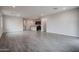 Bright and airy living room with tile floors offers seamless transitions to the kitchen at 1917 S 246Th Ln, Buckeye, AZ 85326