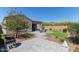Expansive backyard featuring a well-maintained patio area, artificial turf, and desert landscaping at 1919 W Plum Rd, Phoenix, AZ 85085