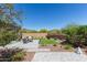 Beautiful backyard with manicured landscaping, patio space, and scenic desert views at 1919 W Plum Rd, Phoenix, AZ 85085