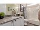 Bathroom vanity with a shower-tub combination and well-lit mirror, alongside neutral wall colors at 1919 W Plum Rd, Phoenix, AZ 85085