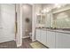 Bathroom with double sinks, granite countertops, and a separate toilet room for added privacy at 1919 W Plum Rd, Phoenix, AZ 85085