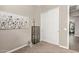 Cozy bedroom with neutral walls, decorative accents, and a double door closet at 1919 W Plum Rd, Phoenix, AZ 85085