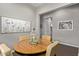 Comfortable dining room with a round wood table, four chairs and decor at 1919 W Plum Rd, Phoenix, AZ 85085