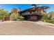 A unique building design with a balcony and stone accents creating an interesting exterior elevation at 1919 W Plum Rd, Phoenix, AZ 85085