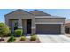 Charming single-story home with a well-manicured front yard and covered entrance at 1919 W Plum Rd, Phoenix, AZ 85085