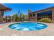 Inviting hot tub with clear blue water, cacti, and building in the background at 1919 W Plum Rd, Phoenix, AZ 85085