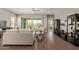Relaxing living room with tile floors, a ceiling fan, sliding glass doors and modern furnishings at 1919 W Plum Rd, Phoenix, AZ 85085