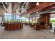 Welcoming lobby with reception desk, cozy fireplace, comfortable leather seating, and panoramic windows framing lush views at 1919 W Plum Rd, Phoenix, AZ 85085