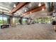 Bright lobby featuring comfortable seating, expansive windows with desert views, and industrial-style ceiling details at 1919 W Plum Rd, Phoenix, AZ 85085