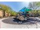 Community playground with shade, slide, and rock climbing feature at 1919 W Plum Rd, Phoenix, AZ 85085