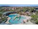 Community splash pad with lounge chairs and shade coverings at 1919 W Plum Rd, Phoenix, AZ 85085