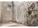 Indoor rock climbing gym with textured wall, colorful holds, concrete wall, and natural light from high window at 1919 W Plum Rd, Phoenix, AZ 85085