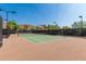 Outdoor tennis court with green surface and black fencing at 1919 W Plum Rd, Phoenix, AZ 85085