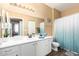 Bathroom featuring a vanity with cabinets, ample counter space, and coordinated decor at 1941 S Pierpont Dr # 1099, Mesa, AZ 85206