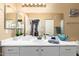 Bathroom vanity with a large mirror, overhead lighting, decor and ample counter space at 1941 S Pierpont Dr # 1099, Mesa, AZ 85206