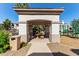 Inviting community entrance featuring a covered seating area, playground view, and well-maintained landscaping at 1941 S Pierpont Dr # 1099, Mesa, AZ 85206