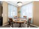 Dining area features an attractive table setting with decorative lighting and wood-look flooring at 1941 S Pierpont Dr # 1099, Mesa, AZ 85206