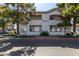 Two-story condo building featuring multiple balconies and well-maintained landscaping at 1941 S Pierpont Dr # 1099, Mesa, AZ 85206