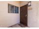 Condo front door with security screen and modern light fixture at 1941 S Pierpont Dr # 1099, Mesa, AZ 85206