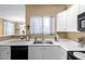 Well-maintained kitchen features white cabinets, modern appliances, and stylish countertops at 1941 S Pierpont Dr # 1099, Mesa, AZ 85206