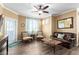 Relaxing living room features a ceiling fan, attractive furniture, and stylish wood-look flooring at 1941 S Pierpont Dr # 1099, Mesa, AZ 85206