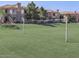 Community with a grass volleyball court and lush landscaping at 1941 S Pierpont Dr # 1099, Mesa, AZ 85206