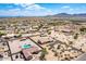 Aerial view showcases the neighborhood and homes with swimming pools at 20041 W Colter St, Litchfield Park, AZ 85340