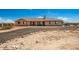 Charming single-story home featuring a well-manicured front yard and a welcoming entrance under a partly cloudy sky at 20041 W Colter St, Litchfield Park, AZ 85340