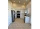 Well-lit kitchen featuring stainless steel appliances, neutral-toned walls, and tile floors at 20041 W Colter St, Litchfield Park, AZ 85340