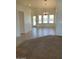 Bright living area featuring neutral-toned walls, and tile floors at 20041 W Colter St, Litchfield Park, AZ 85340
