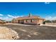 Back of single-story home featuring a well-manicured yard, a convenient access to the garage at 20041 W Colter St, Litchfield Park, AZ 85340