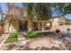 Expansive backyard with a covered patio, manicured lawn, and a sparkling pool offers ample space for outdoor living and enjoyment at 20709 W Delaney Dr, Buckeye, AZ 85396