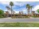 Verado Golf Club entrance with well-manicured landscaping and a grand clubhouse at 20709 W Delaney Dr, Buckeye, AZ 85396